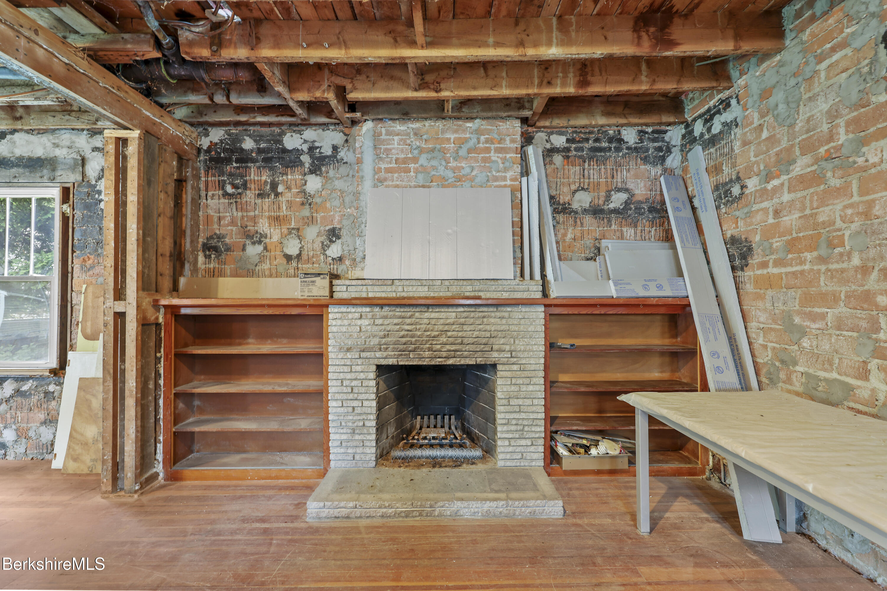 84 Notch Road North Adams, MA 01247 - Photo 9 of 30 a living room with a wooden floor and a fireplace