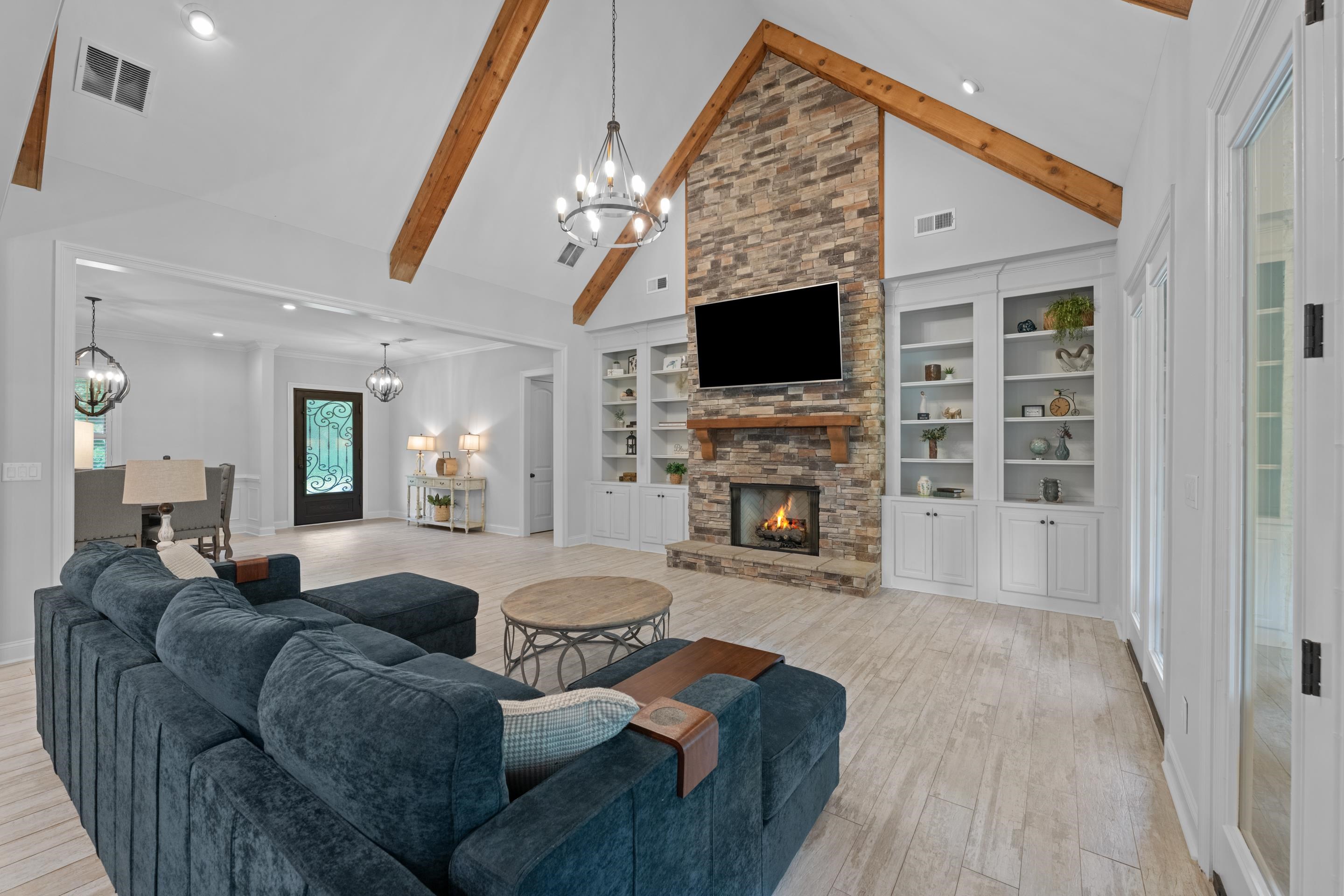 10354 Pleasant Ridge Road Arlington, TN 38002 - Photo 7 of 40 Designed for relaxing and entertaining, this open living space offers beautiful architectural details, abundant natural light, and easy access to the covered outdoor living area.