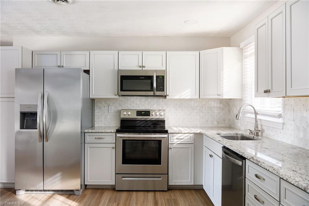 3025 Hickory Tree Road Winston-Salem, NC 27127 - Photo 17 of 33 Gorgeous Kitchen with Stainless Steel Appliances