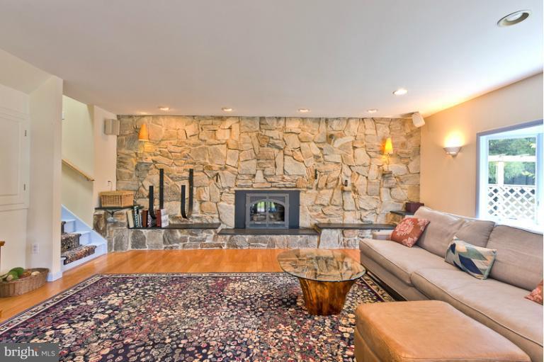 1263 Magothy Road Pasadena, MD 21122 - Photo 3 of 30 Flagstone wall & gas fireplace in living room