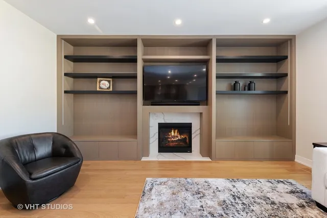 a living room with a couch and a fireplace