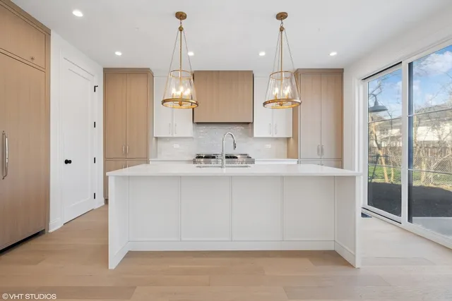 a bathroom with a sink tub and a large mirror