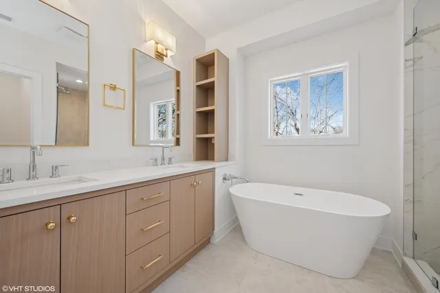 a spacious bathroom with a bathtub and sink