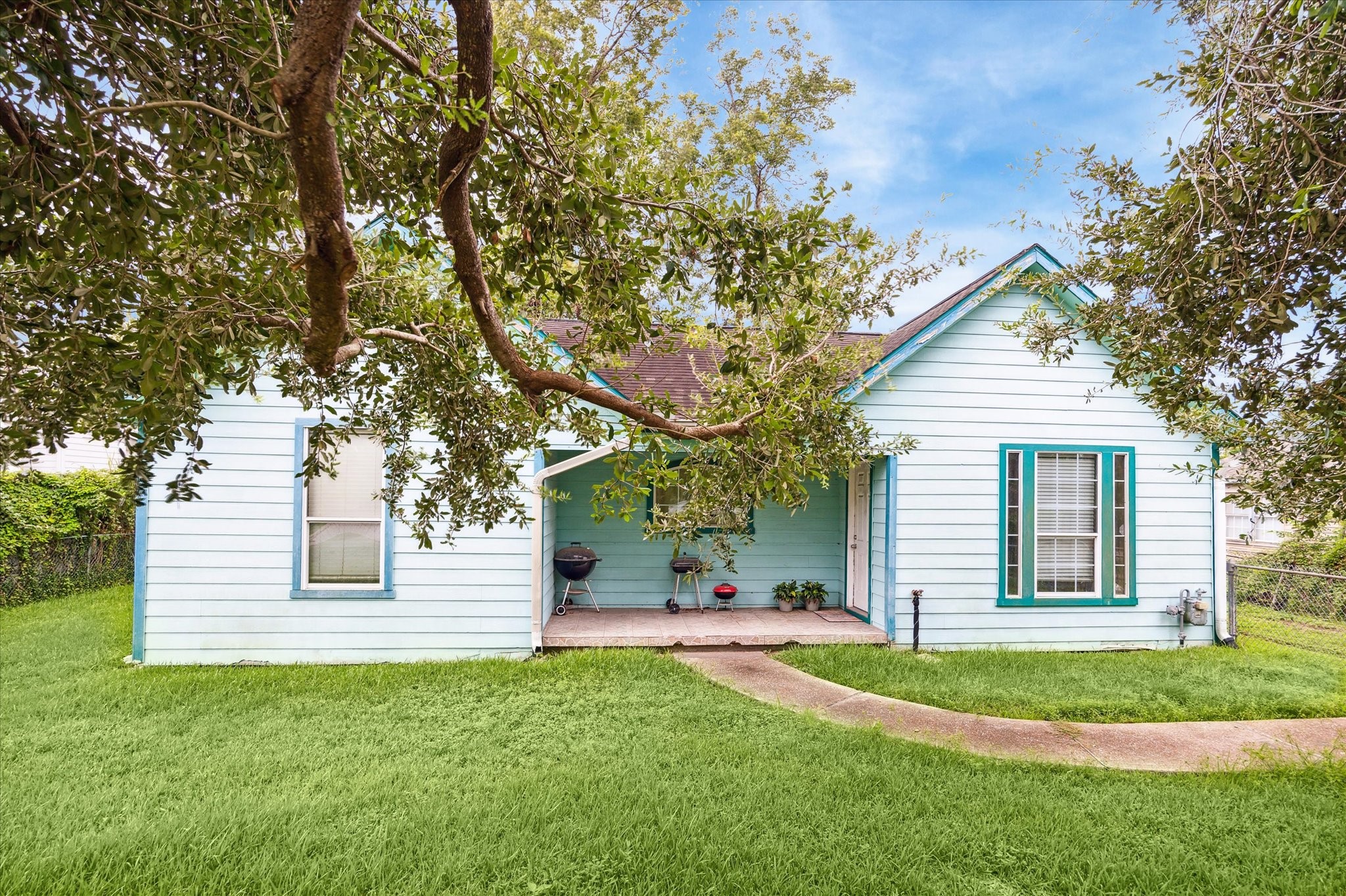405 West Donovan Street Houston, TX 77091 - Photo 2 of 9 a front view of a house with a yard and garage