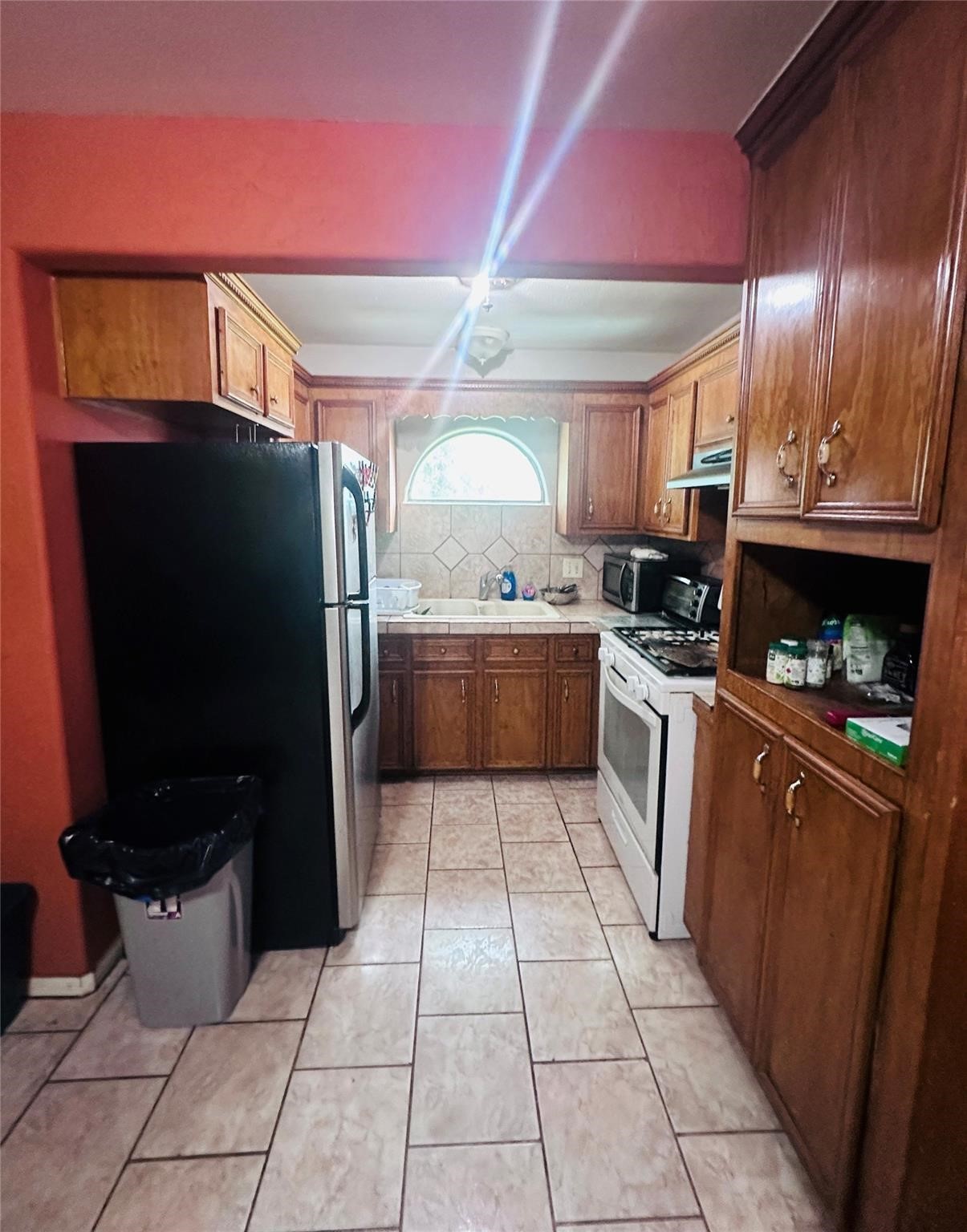 405 West Donovan Street Houston, TX 77091 - Photo 8 of 9 a large kitchen with stainless steel appliances granite countertop a refrigerator and a stove