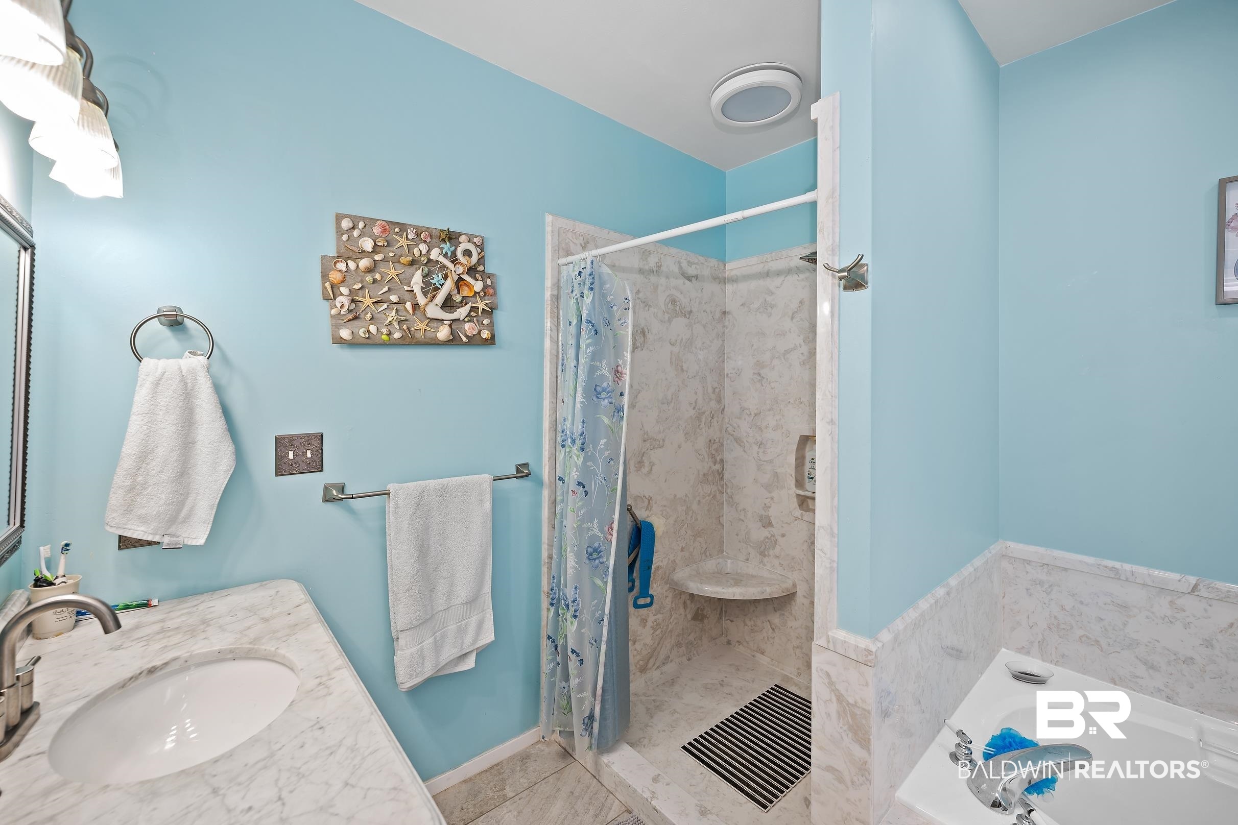 2674 Pine Ridge Drive Lillian, AL 36549 - Photo 12 of 42 Bathroom with a shower stall, vanity, a garden tub, and tile patterned floors