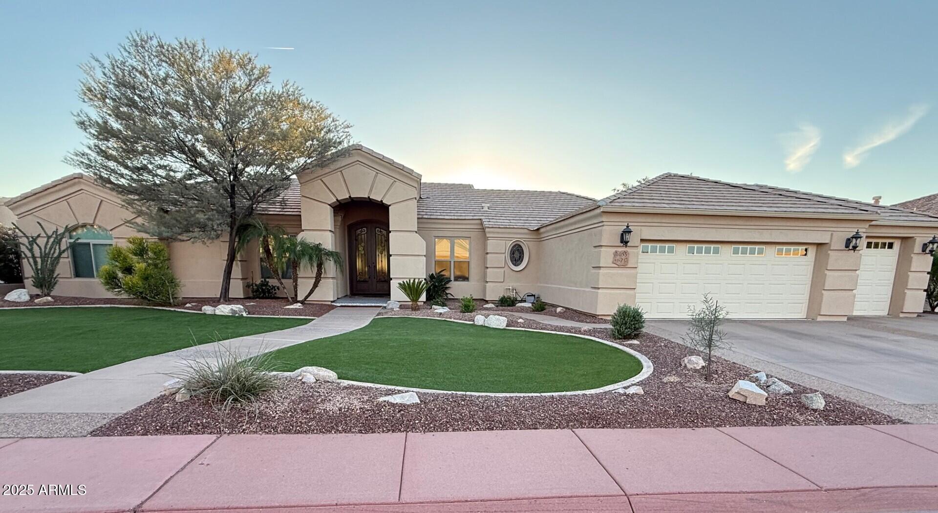 a view of a house with a swimming pool and a yard