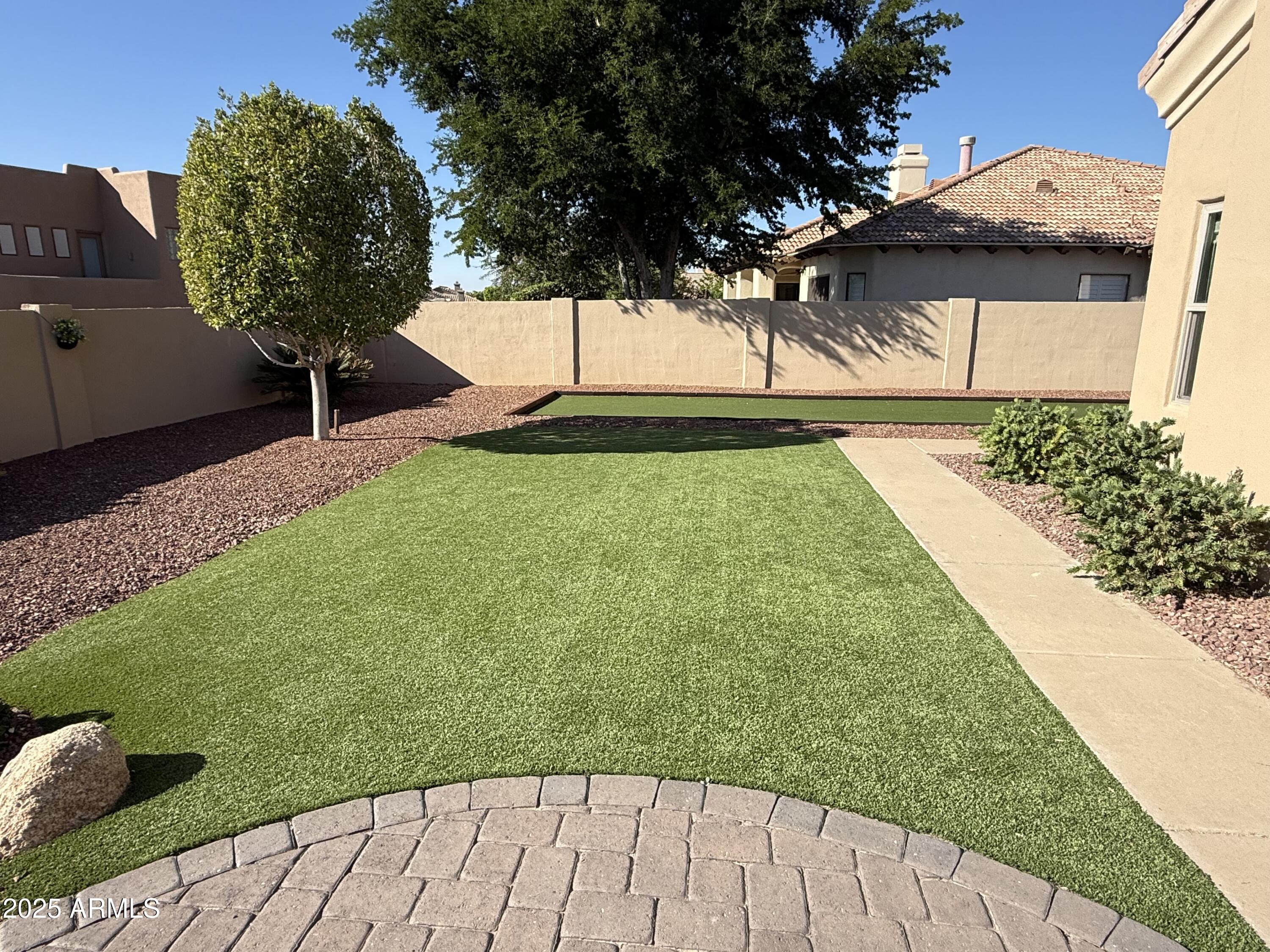 4055 North Recker Road, Unit 62 Mesa, AZ 85215 - Photo 12 of 47 a view of a backyard