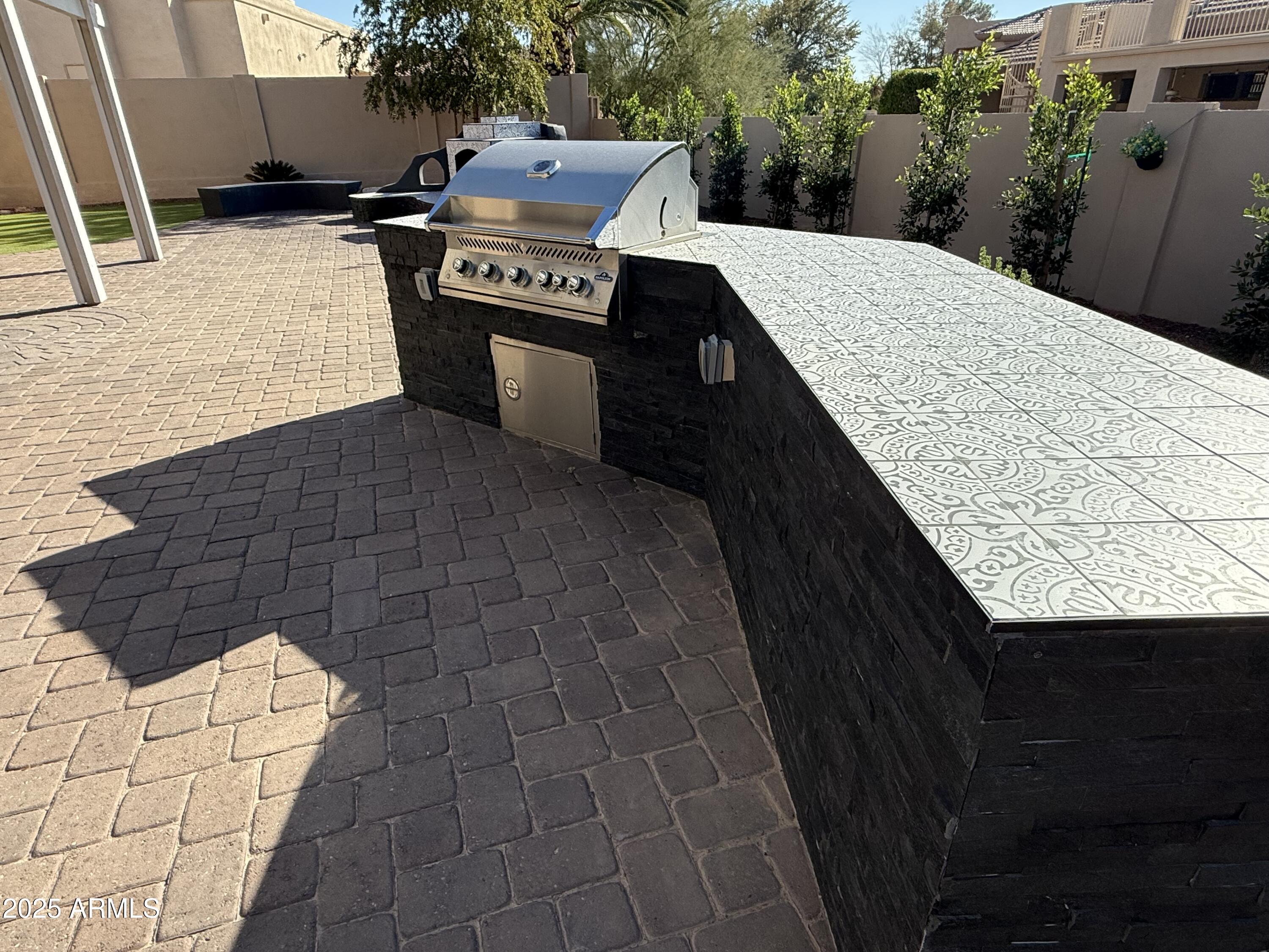 4055 North Recker Road, Unit 62 Mesa, AZ 85215 - Photo 14 of 47 a terrace with a sink