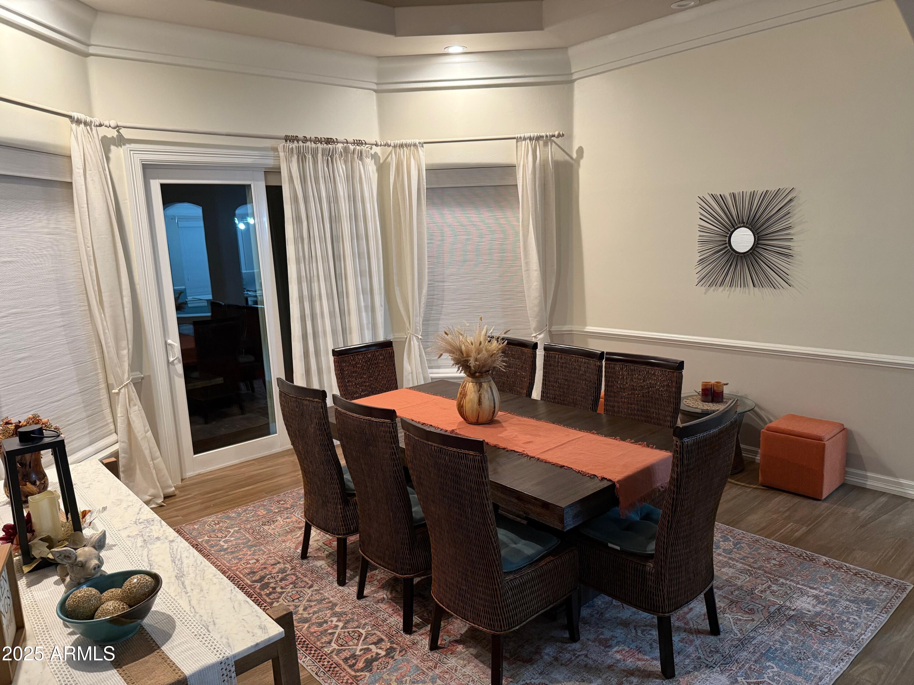 4055 North Recker Road, Unit 62 Mesa, AZ 85215 - Photo 18 of 47 a dining room with furniture and window