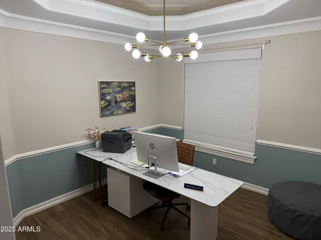 a view of a workspace with furniture