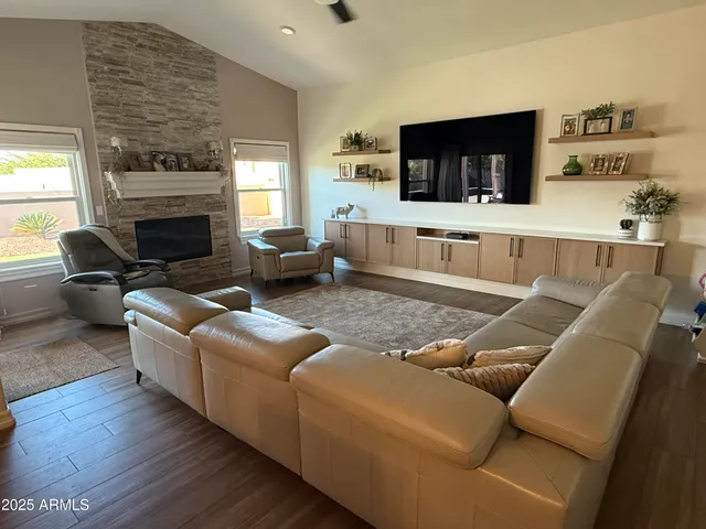 a living room with furniture and a fireplace
