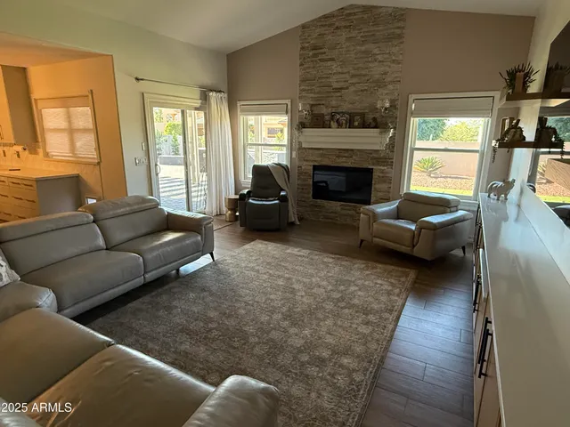 a living room with furniture and a rug