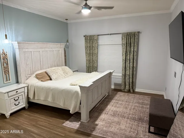 a spacious bathroom with a granite countertop sink and a mirror