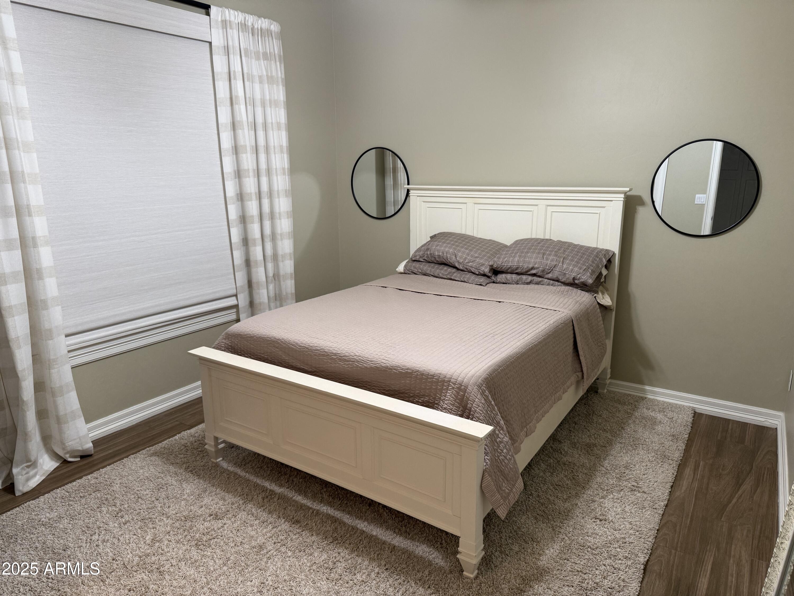 4055 North Recker Road, Unit 62 Mesa, AZ 85215 - Photo 37 of 47 a bedroom with a bed and window