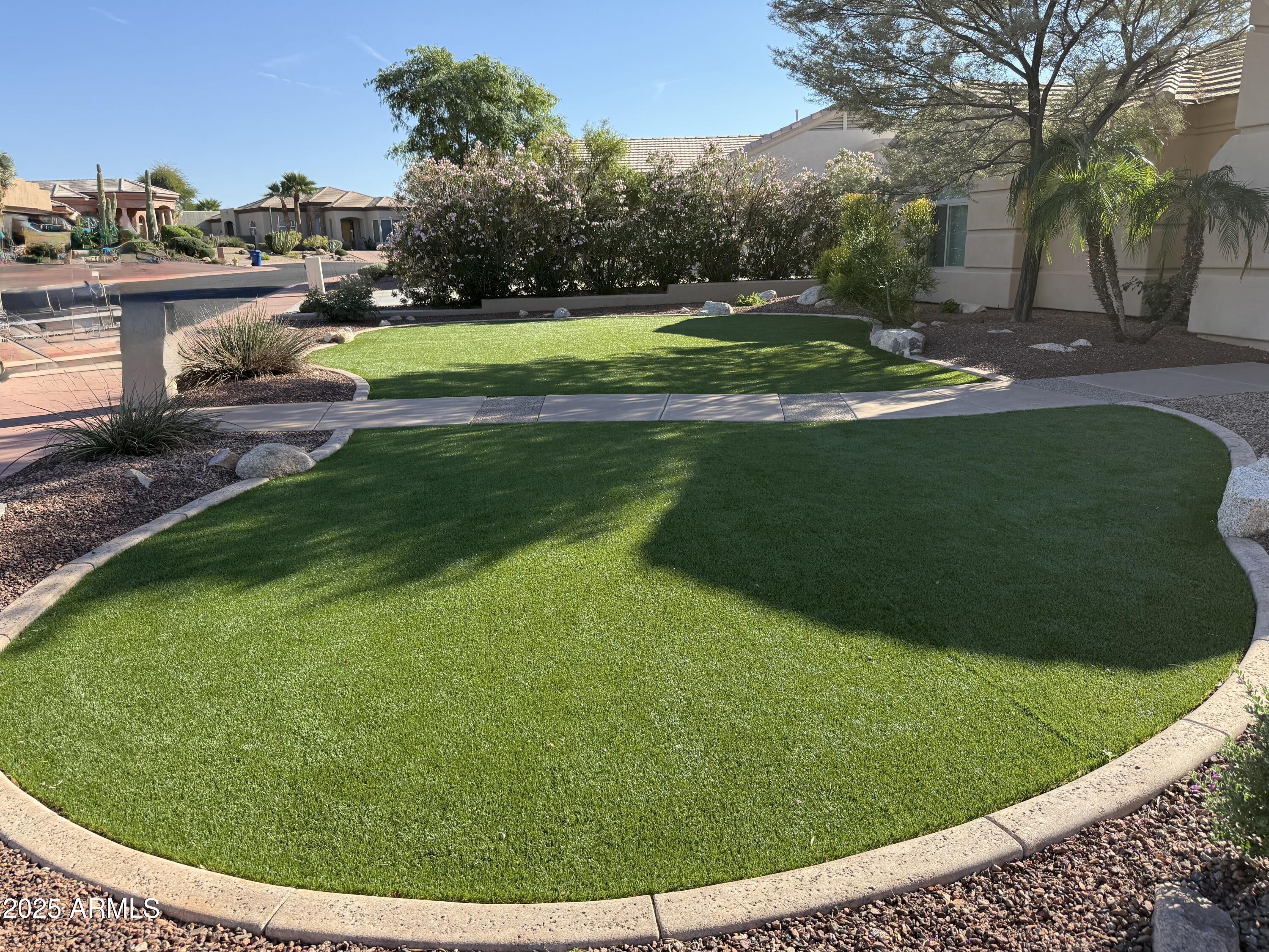 4055 North Recker Road, Unit 62 Mesa, AZ 85215 - Photo 3 of 47 a view of a golf course with a lake