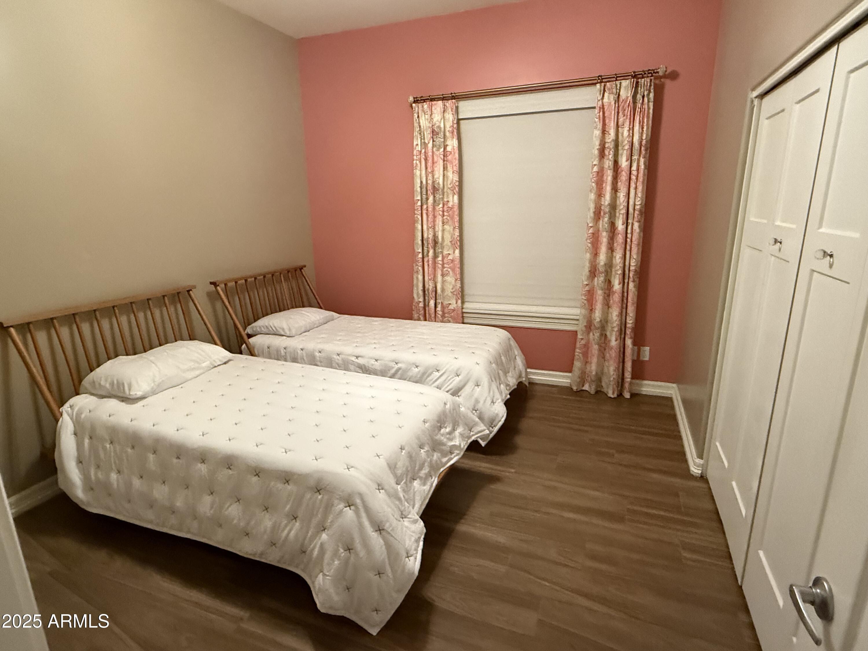 4055 North Recker Road, Unit 62 Mesa, AZ 85215 - Photo 41 of 47 a bed sitting in a bedroom next to a bathroom