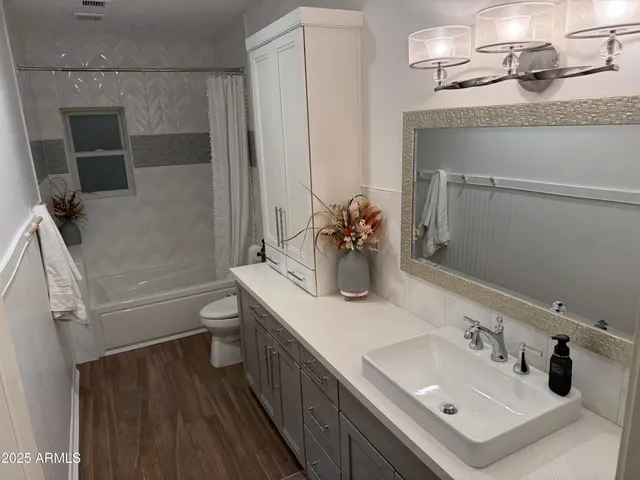 a utility room with sink dryer and washer
