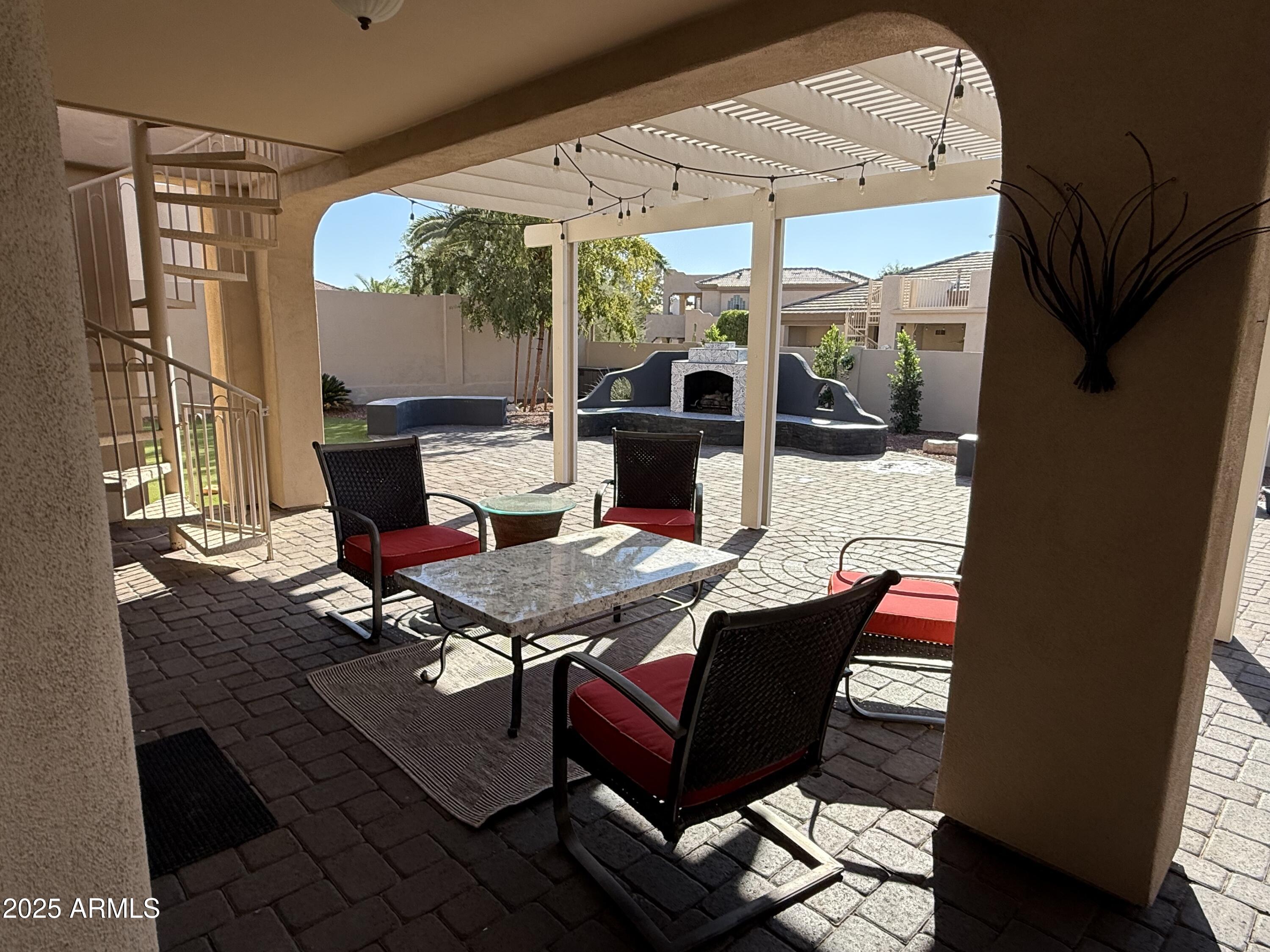 4055 North Recker Road, Unit 62 Mesa, AZ 85215 - Photo 8 of 47 a outdoor space with patio the couches and a dining table with garden view