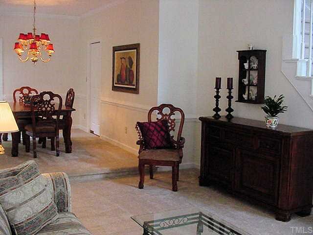 3113 Hiking Trail Raleigh, NC 27615 - Photo 4 of 12 Living Room steps up to large open Dining Room with great viiews of private backyard!