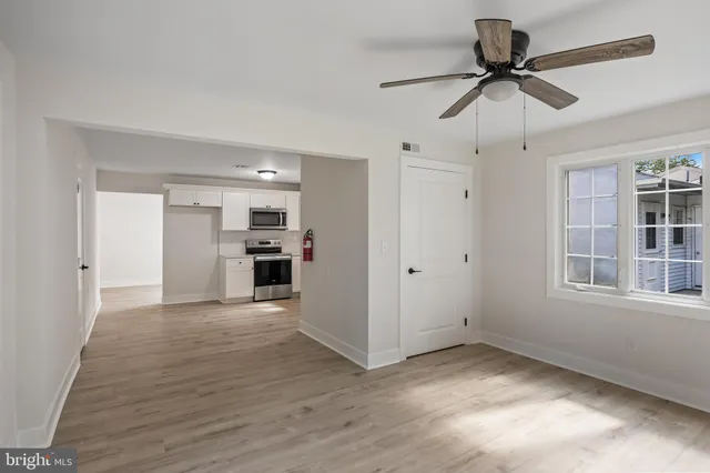 a view of a kitchen with a sink and cabinet area