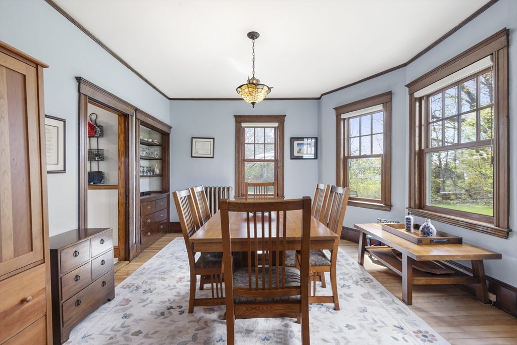 54 Oak Street Dedham, MA 02026 - Photo 11 of 36 a dining room with furniture a chandelier and wooden floor