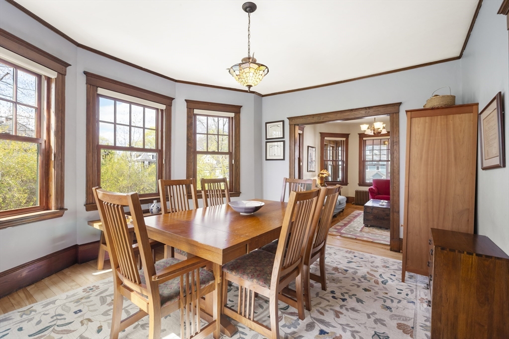 54 Oak Street Dedham, MA 02026 - Photo 12 of 36 a dining room with furniture a chandelier and wooden floor