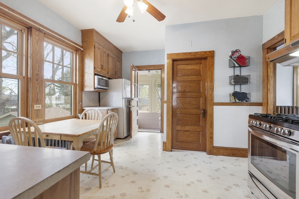 54 Oak Street Dedham, MA 02026 - Photo 16 of 36 a dining room with furniture and a kitchen