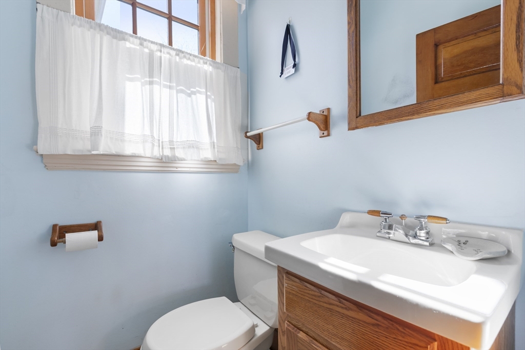 54 Oak Street Dedham, MA 02026 - Photo 17 of 36 a bathroom with a sink and a toilet