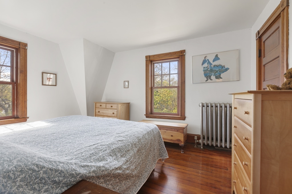 54 Oak Street Dedham, MA 02026 - Photo 20 of 36 a bedroom with a bed and a window