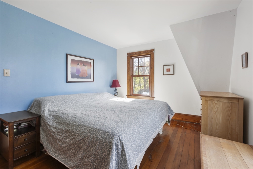 54 Oak Street Dedham, MA 02026 - Photo 21 of 36 a bedroom with bed and window