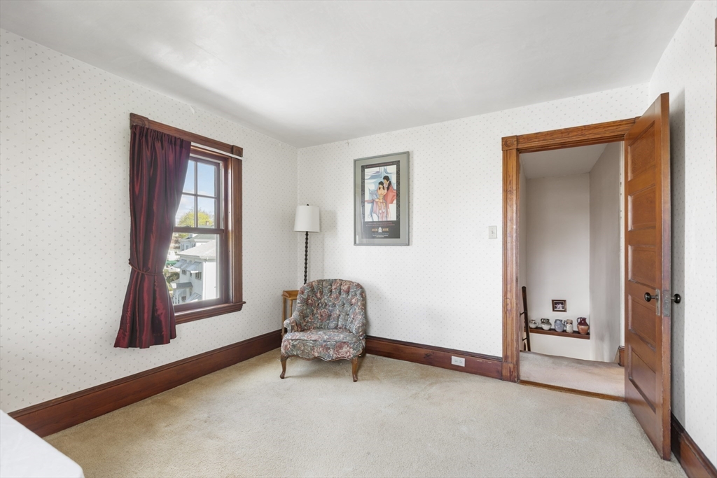 54 Oak Street Dedham, MA 02026 - Photo 24 of 36 a living room with furniture and a window