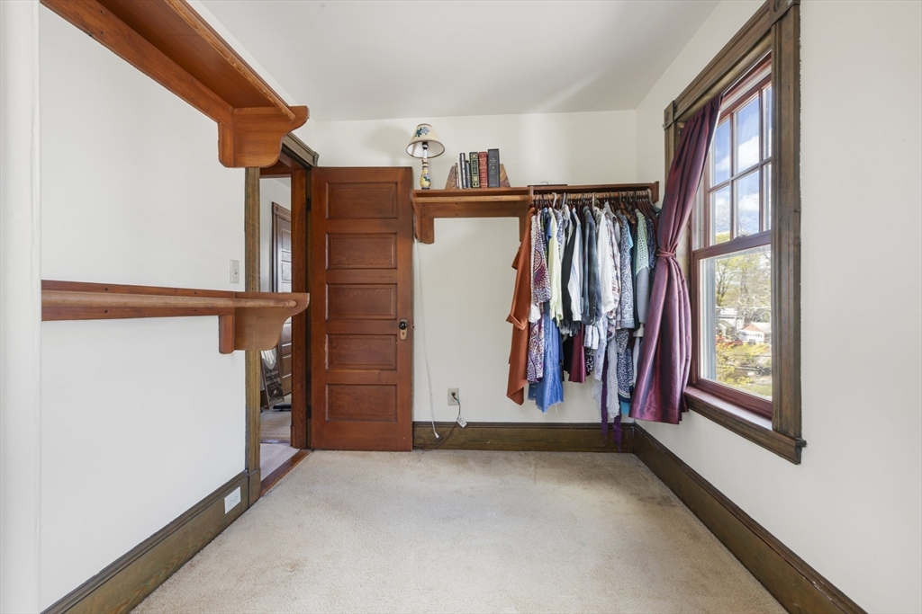 54 Oak Street Dedham, MA 02026 - Photo 26 of 36 a view of a closet with storage
