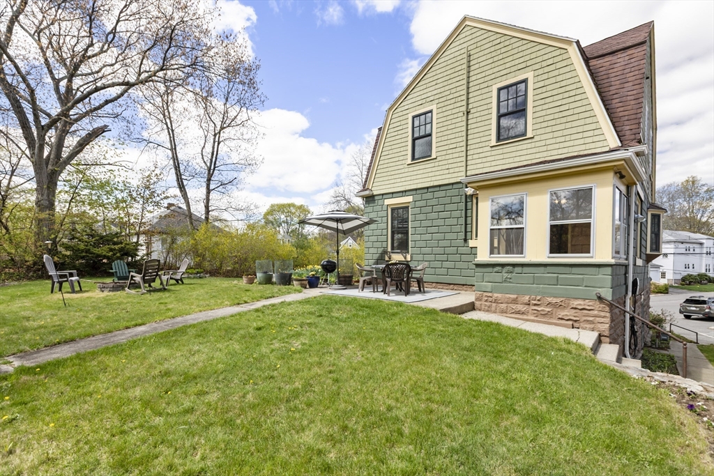54 Oak Street Dedham, MA 02026 - Photo 29 of 36 a view of a house with a yard