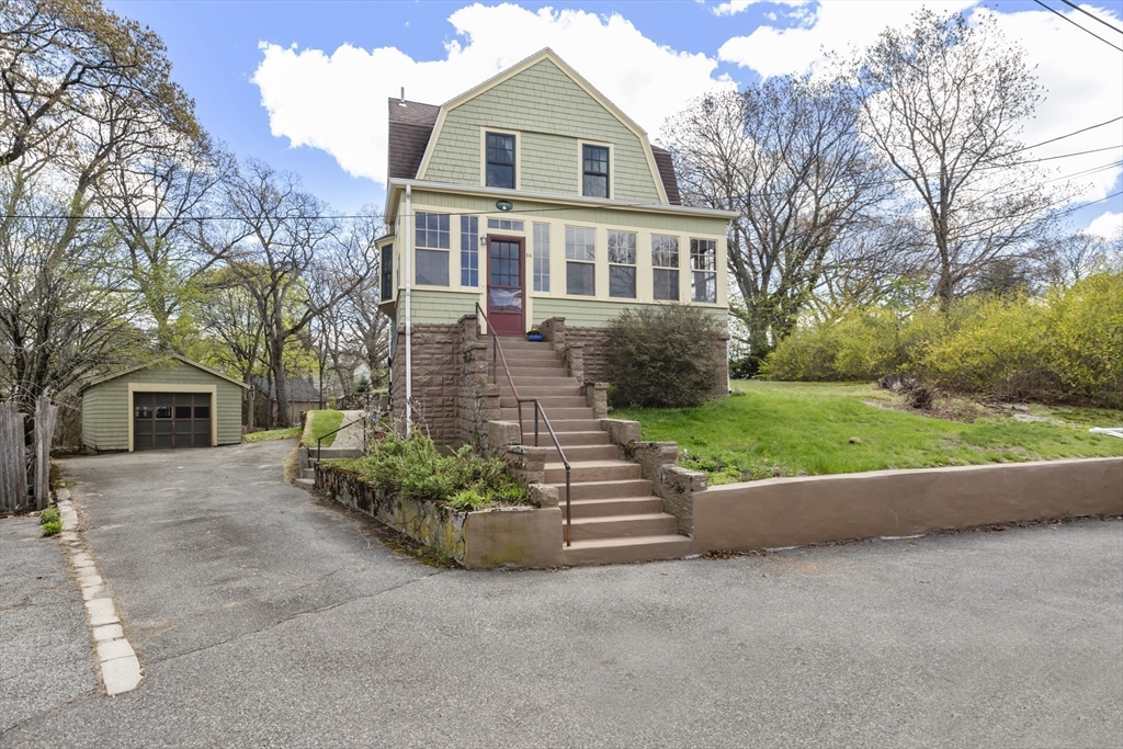 54 Oak Street Dedham, MA 02026 - Photo 33 of 36 front view of a house with a yard