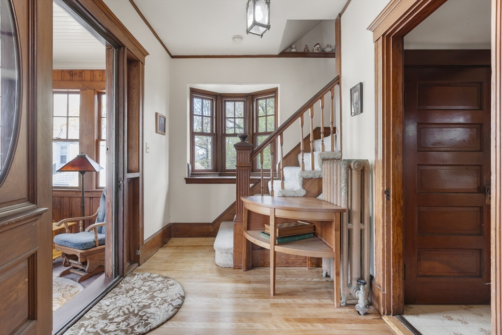 54 Oak Street Dedham, MA 02026 - Photo 6 of 36 a view of entryway bedroom and hall with wooden floor