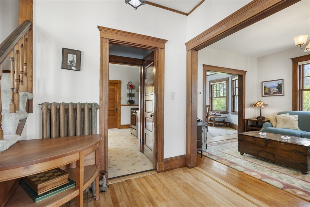 54 Oak Street Dedham, MA 02026 - Photo 7 of 36 a living room with furniture and a wooden floor