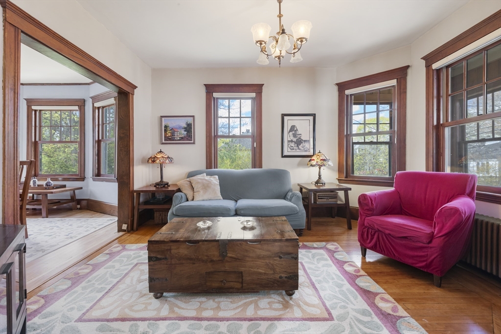 54 Oak Street Dedham, MA 02026 - Photo 9 of 36 a living room with furniture ceiling fan and a window