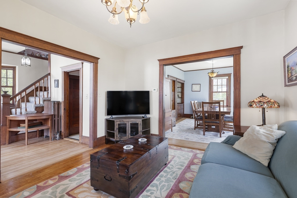 54 Oak Street Dedham, MA 02026 - Photo 10 of 36 a living room with furniture and a flat screen tv