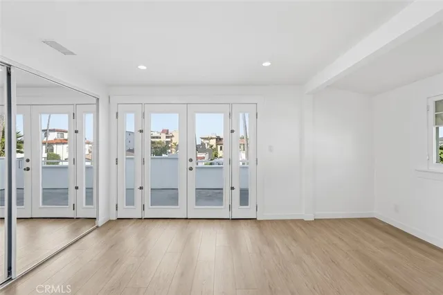 wooden floor with white walls