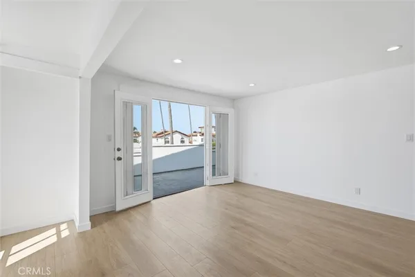 a view of a kitchen with a sink cabinets and wooden floor