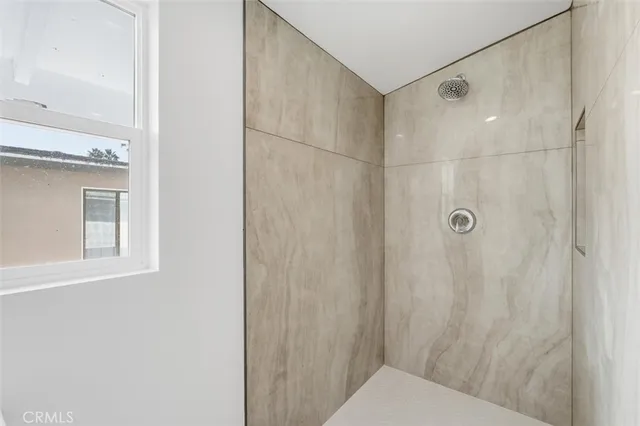 a bathroom with a shower and a toilet