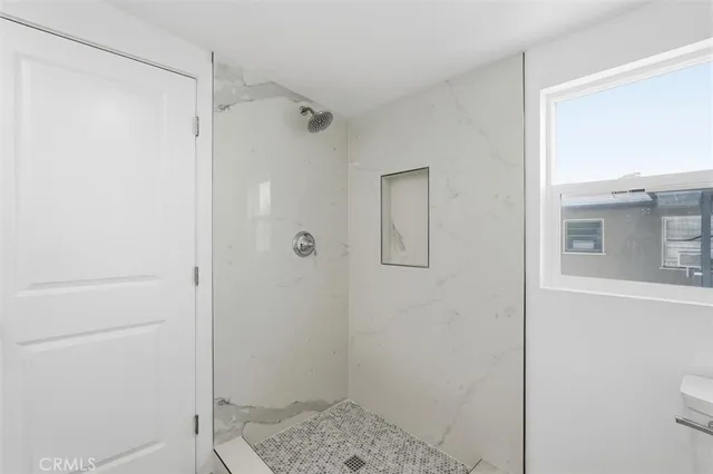 a bathroom with a shower and a toilet