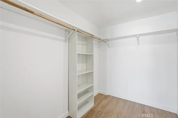 a view of an empty walk in closet