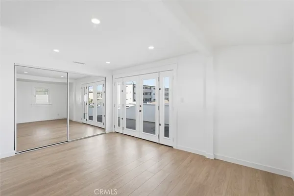 wooden floor with white walls