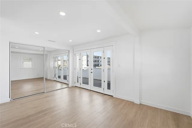 wooden floor with white walls