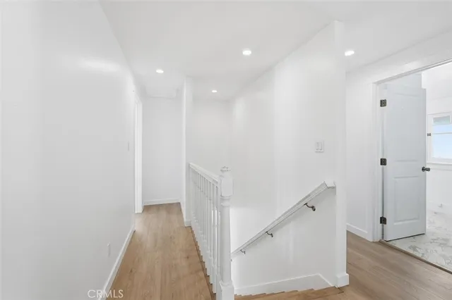 a view of a hallway with white walls