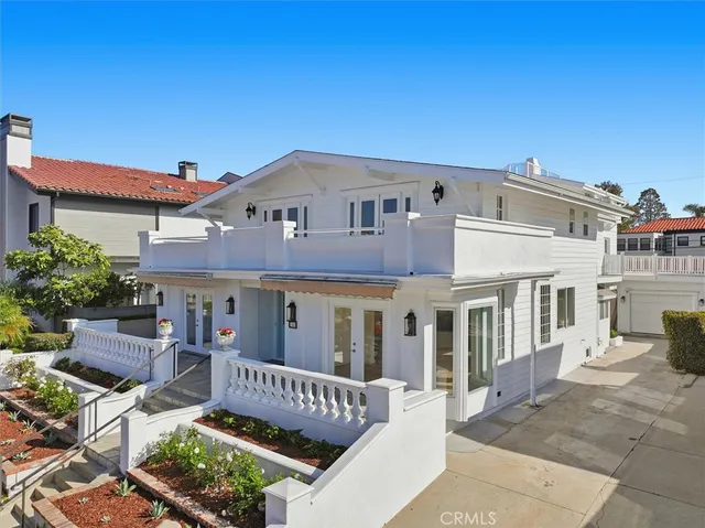 front view of a house with a bench
