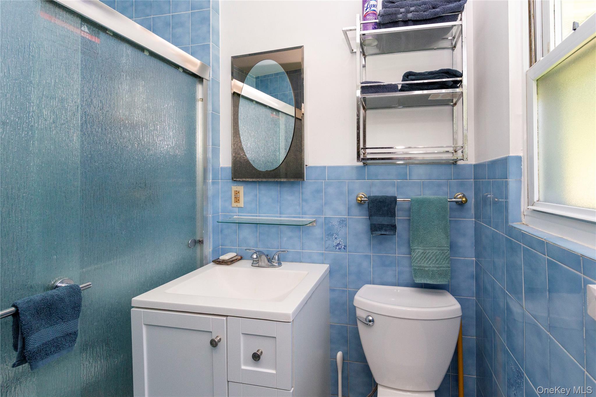 32 Cobb Road Brewster, NY 10509 - Photo 32 of 49 a bathroom with a toilet sink and mirror