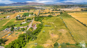 19 East Southfield Road Spanish Fork, UT 84660 - Photo 25 of 74 Aerial view of property's location with rural landscape and a mountainous background